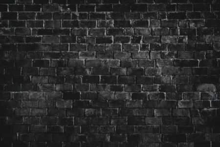 Black textured brick wall background