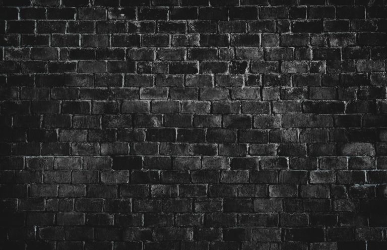 Black textured brick wall background