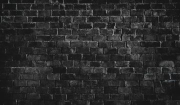 Black textured brick wall background